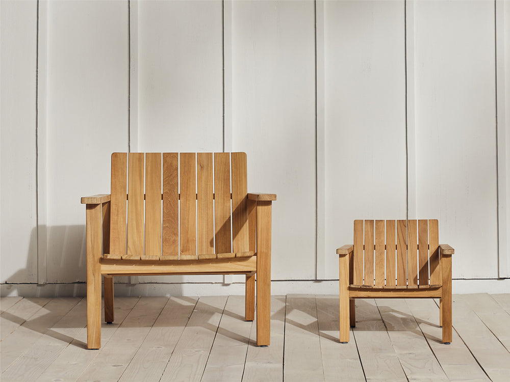 A Neighbor teak Low Chair and Low Chair Jr. sitting side-by-side.