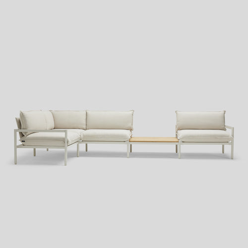 A studio photo of Terra Sectional with In-line Table Putty / Four Piece with In-line Table / Table