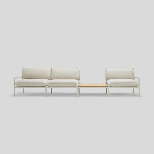 A studio photo of Terra Sofa with In-line Table Putty / Table